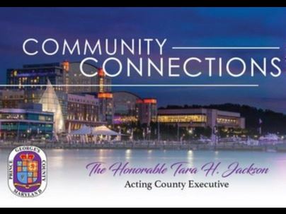 picture of National Harbor at night with purple ferris wheel in foreground