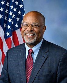 Professional headshot of Congressman Glenn Ivey in front of an American flag